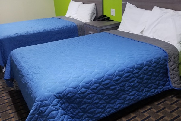 Economy Double Room, 2 Double Beds, Non Smoking | Individually decorated, individually furnished, desk, soundproofing