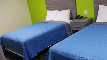 Economy Double Room, 2 Double Beds, Non Smoking | Individually decorated, individually furnished, desk, soundproofing