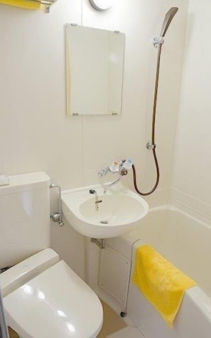 Combined shower/tub, free toiletries, hair dryer, slippers