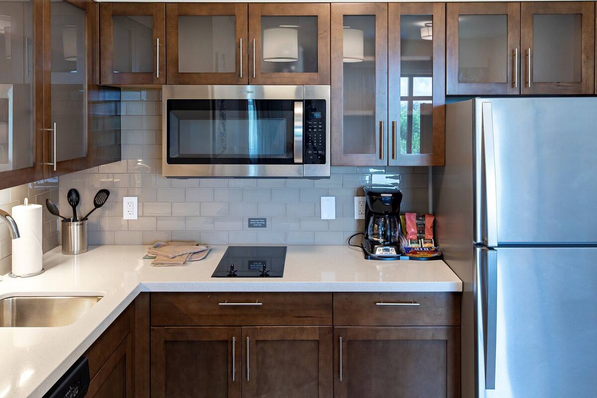 full-sized fridge, microwave, stovetop, dishwasher