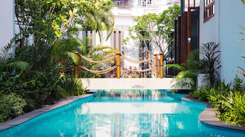 Outdoor pool, open 6:00 AM to 7:00 PM, pool loungers