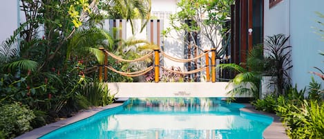 Outdoor pool, open 6:00 AM to 7:00 PM, sun loungers