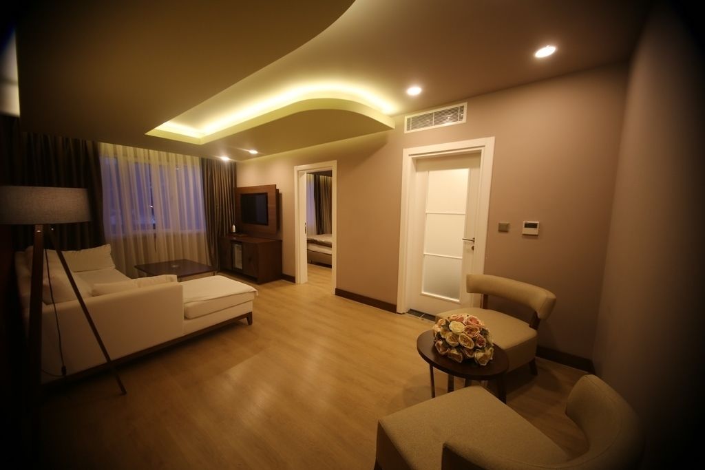 Suite, 1 Bedroom | Living room | 19-inch LCD TV with satellite channels, TV