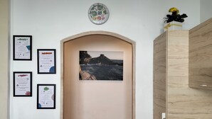 A room with a framed certificate, a framed certificate, a framed certificate, a framed certificate, and a framed certificate.