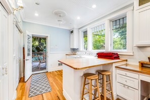 Enjoy cooking in this well-equipped kitchen with a large island and oven.