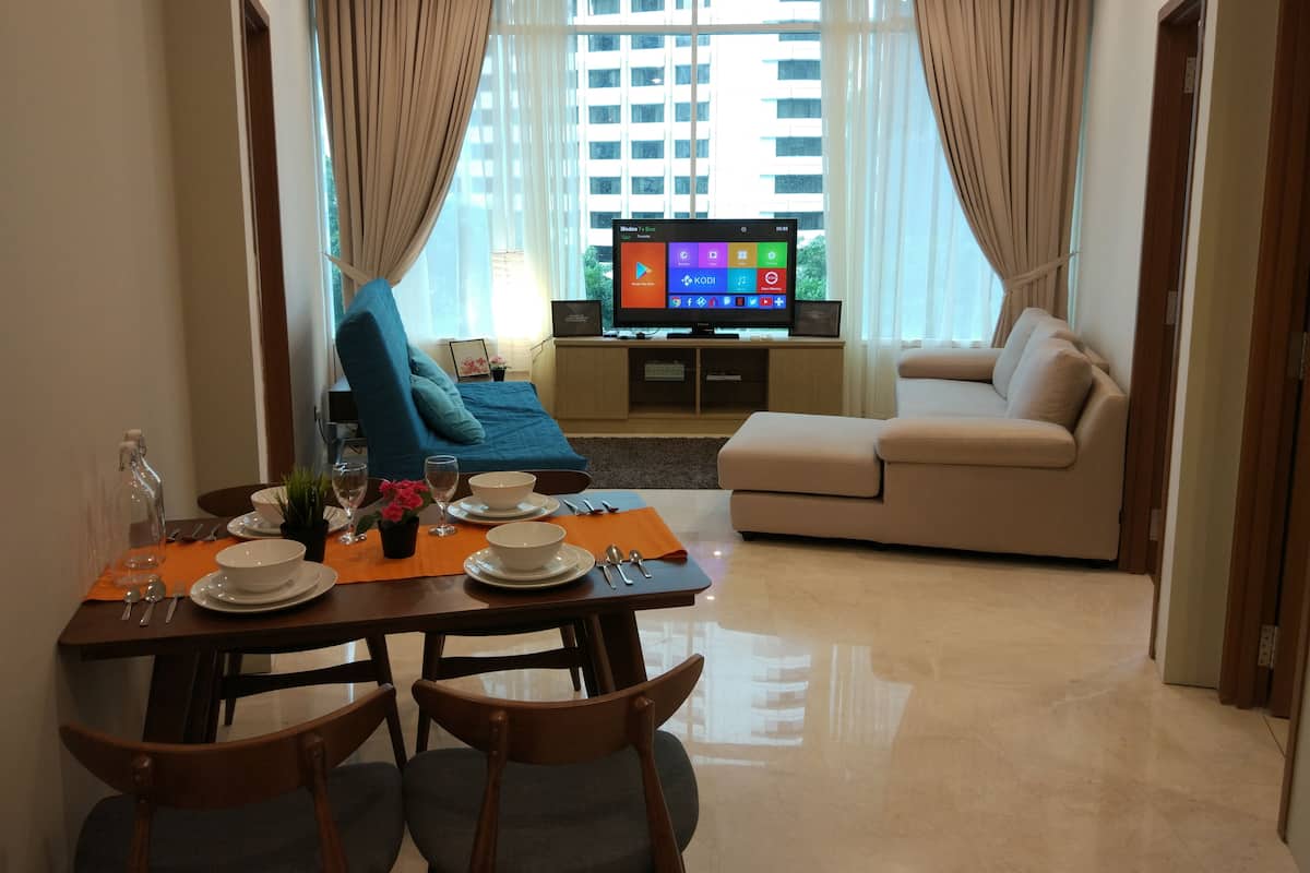 Basic Apartment, 3 Bedrooms | Living area | Flat-screen TV