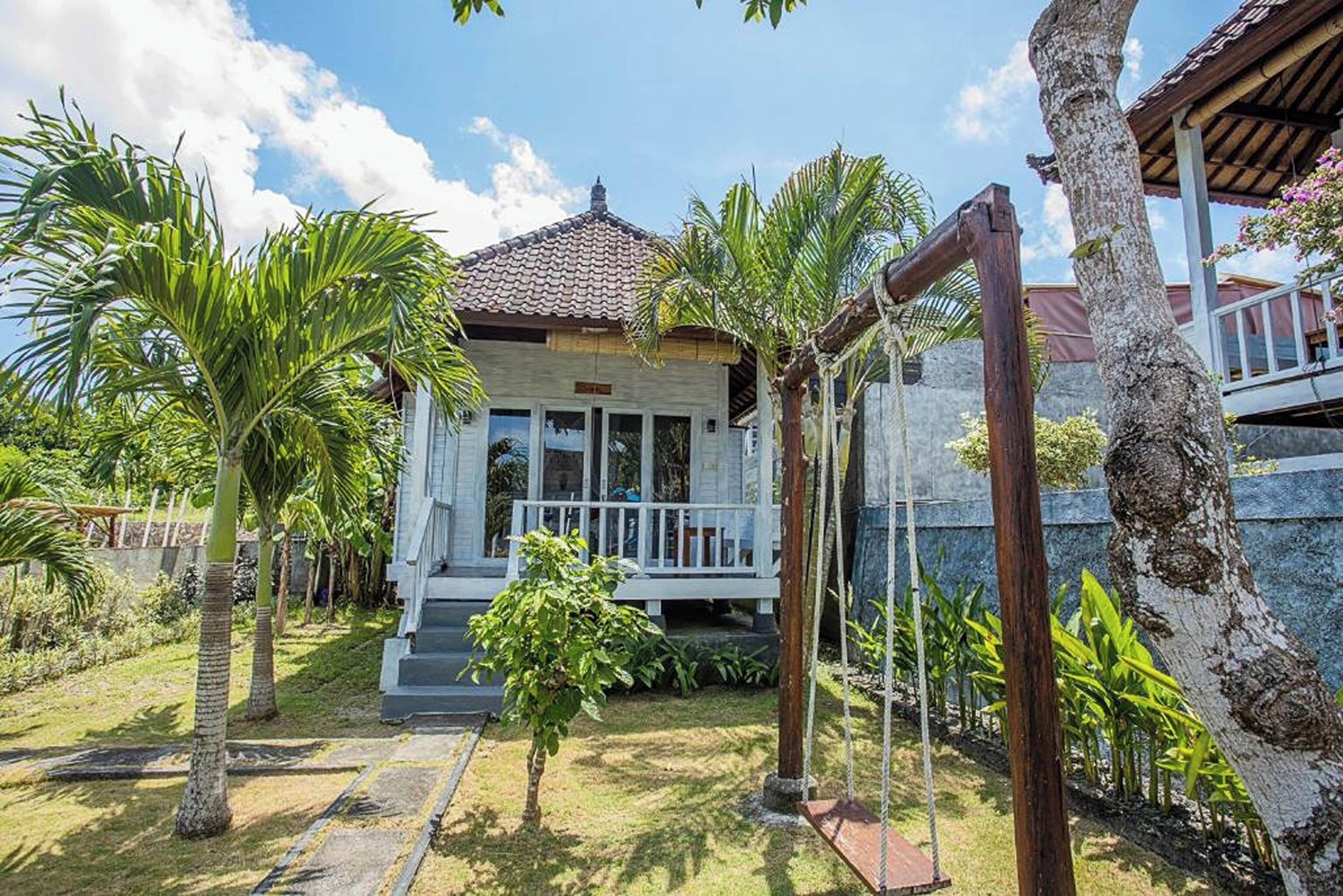 Deluxe Room, Pool View | 1 bedroom, minibar, in-room safe, desk