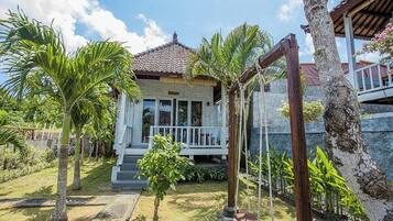 Deluxe Room, Pool View | 1 bedroom, minibar, in-room safe, desk