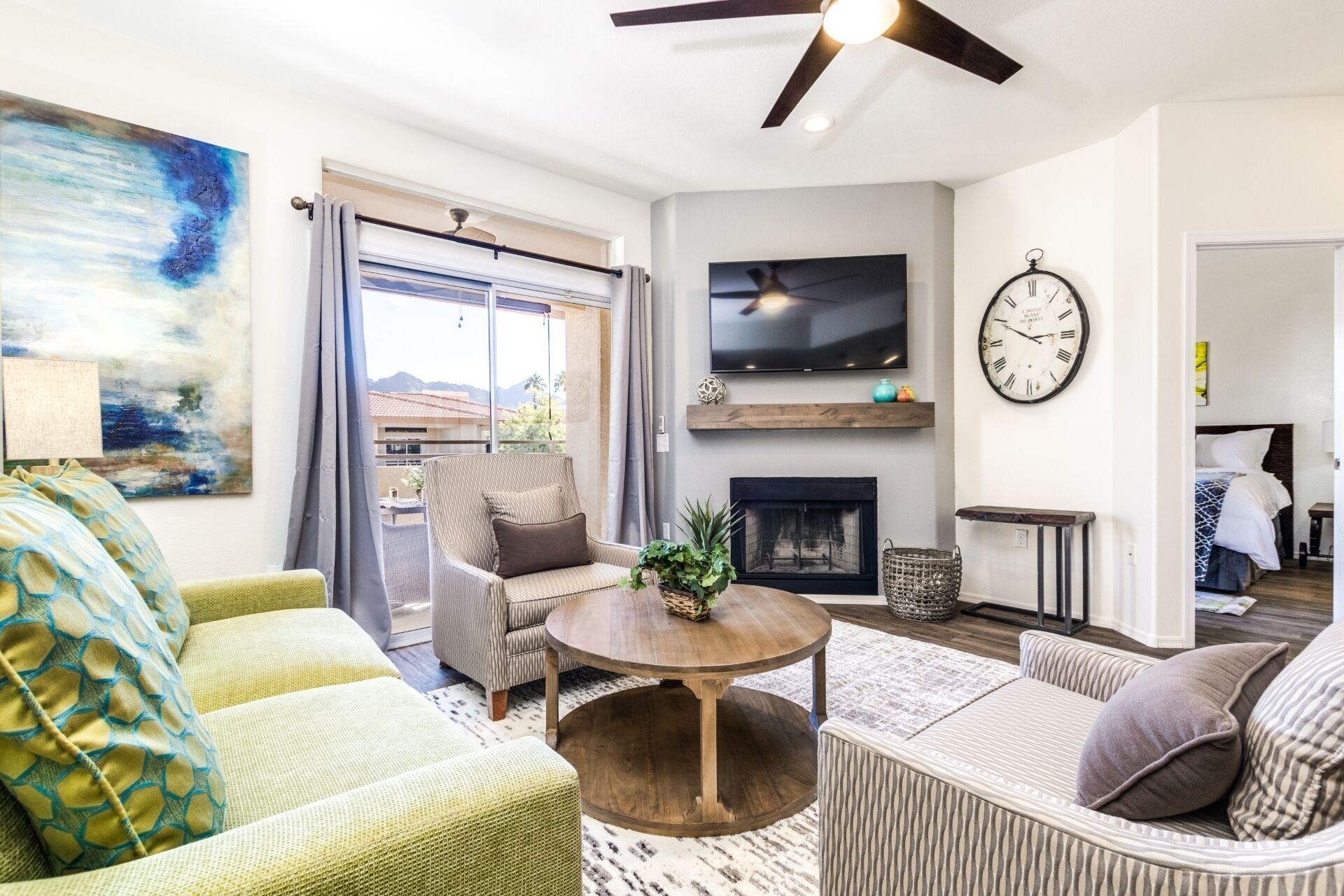 Flat-screen TV, fireplace, books