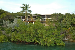 The guest house is nestled in the foliage of Stocking Island.