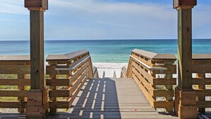 A wooden boardwalk leading to a beach with a clear view of the ocean. - Aug/Sept Openings SAVE Large Walk Off  Patio w/Grill. 2 Pools, Beach Service!!!! (Miramar Beach)