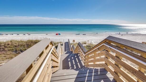 A wooden boardwalk leading to a beach with clear skies and calm waters. - Aug/Sept Openings SAVE Large Walk Off  Patio w/Grill. 2 Pools, Beach Service!!!! (Miramar Beach)