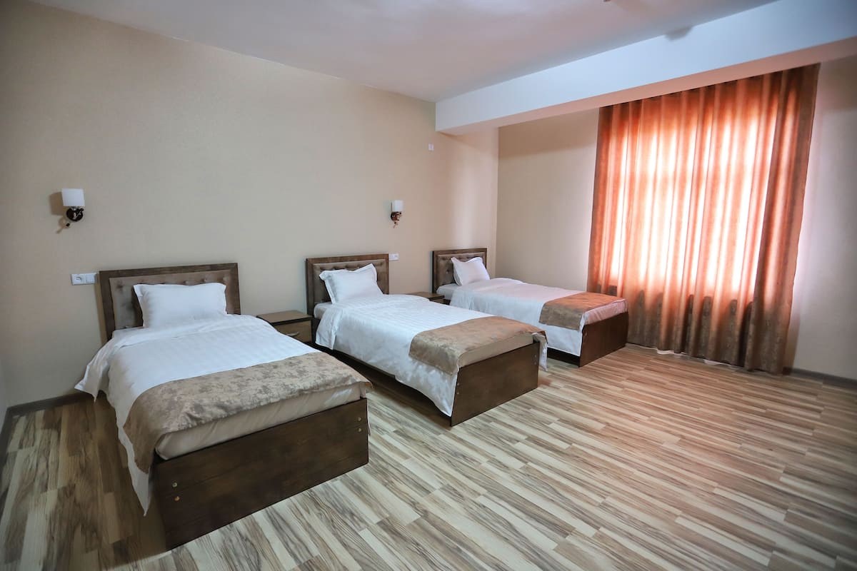 Standard Triple Room | Desk, blackout drapes, soundproofing, free WiFi