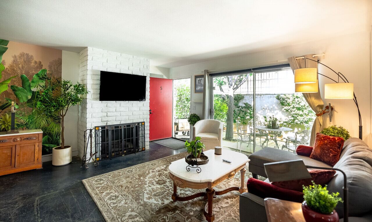 Newly remodeled, uniquely styled property surrounded by botanical-like garden setting.