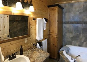 Combined shower/bathtub, hair dryer, towels, soap