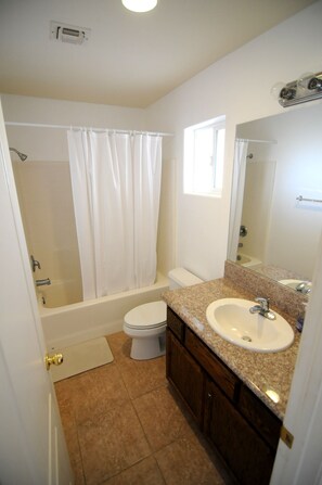 Combined shower/bathtub, hair dryer, towels, soap