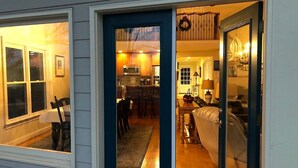 A home interior with a dining area, kitchen, and living room.
