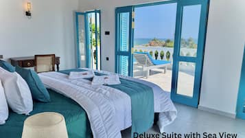 Studio Suite Deluxe, 1 giường cỡ king, máy điều hòa, quang cảnh biển | Bộ trải giường bằng vải cotton Ai Cập, bộ đồ giường cao cấp, minibar