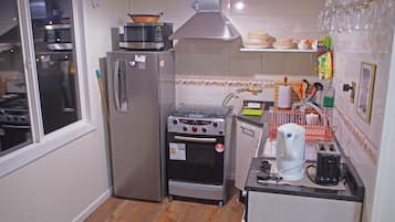 Cabin, Multiple Beds, Non Smoking | Private kitchen | Fridge, microwave, oven, stovetop