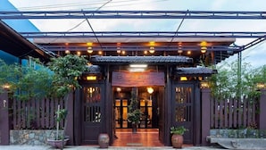 A traditional-style building with a sign reading "AN BANG". - An Bang Stilt House (Da Nang)
