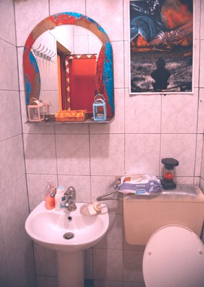 Shower, hair dryer, slippers, towels