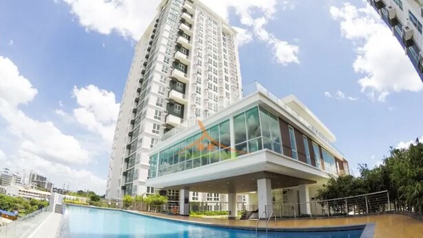 A modern building with a swimming pool in front. - Your Dream Home at Abreeza Davao (Davao)
