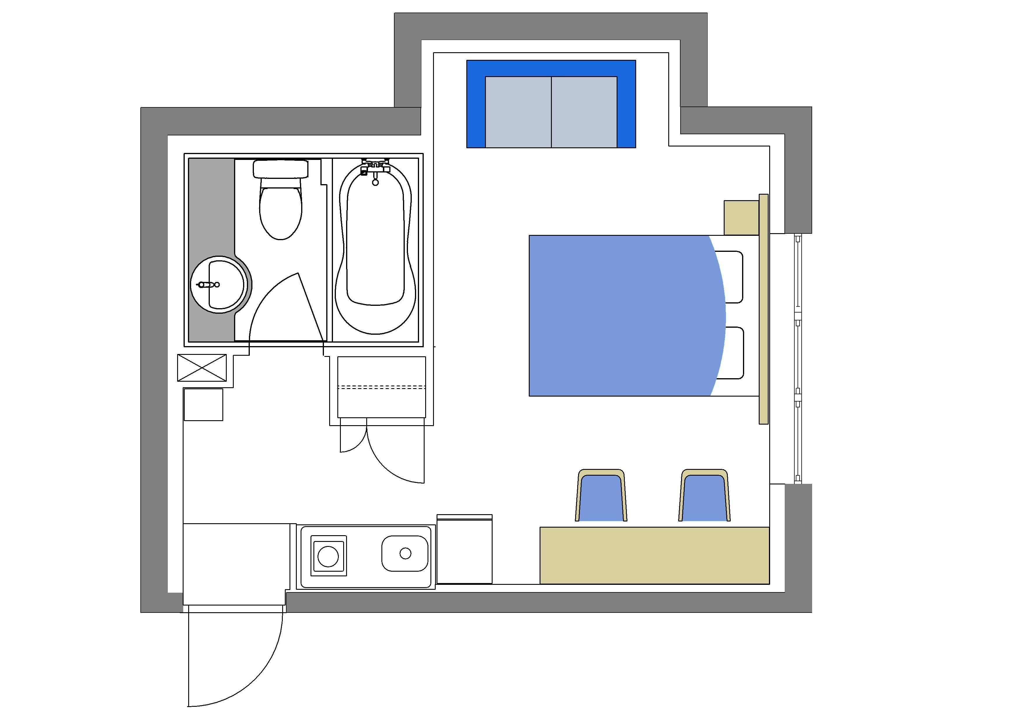 A floor plan of a hotel room with a bed, a bathroom, a desk, and a small kitchenette.