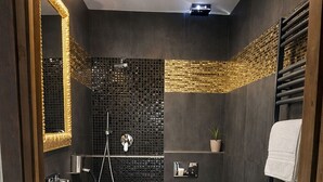 A modern bathroom with a wooden vanity, a white sink, a toilet, and a shower. - Ca' Elsa Bed & Breakfast (Dubino)