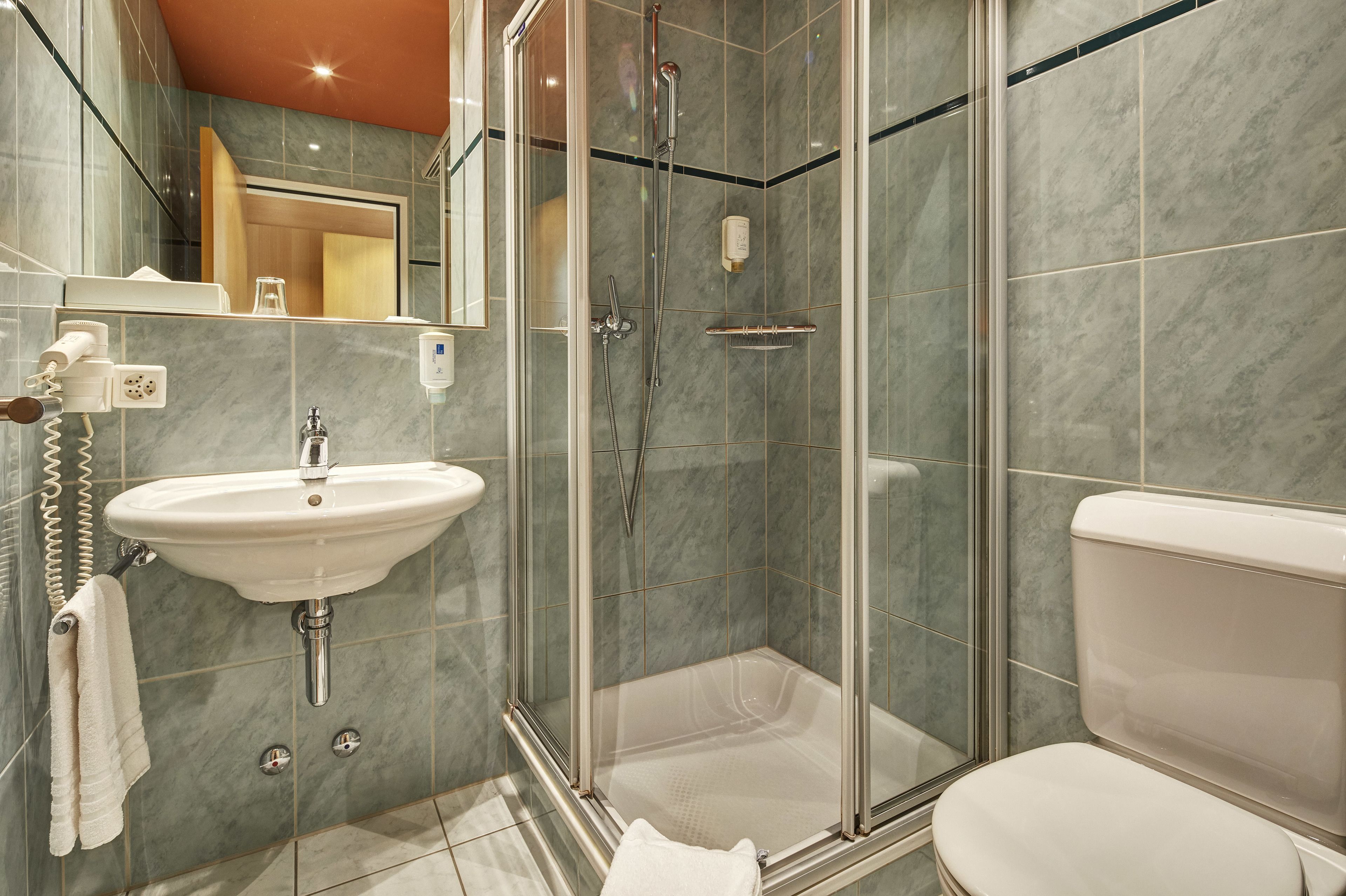 hair dryer, towels, soap, shampoo