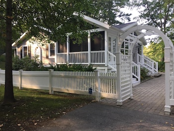 Light, airy, comfy, casual, wooded, lakefront home with private 