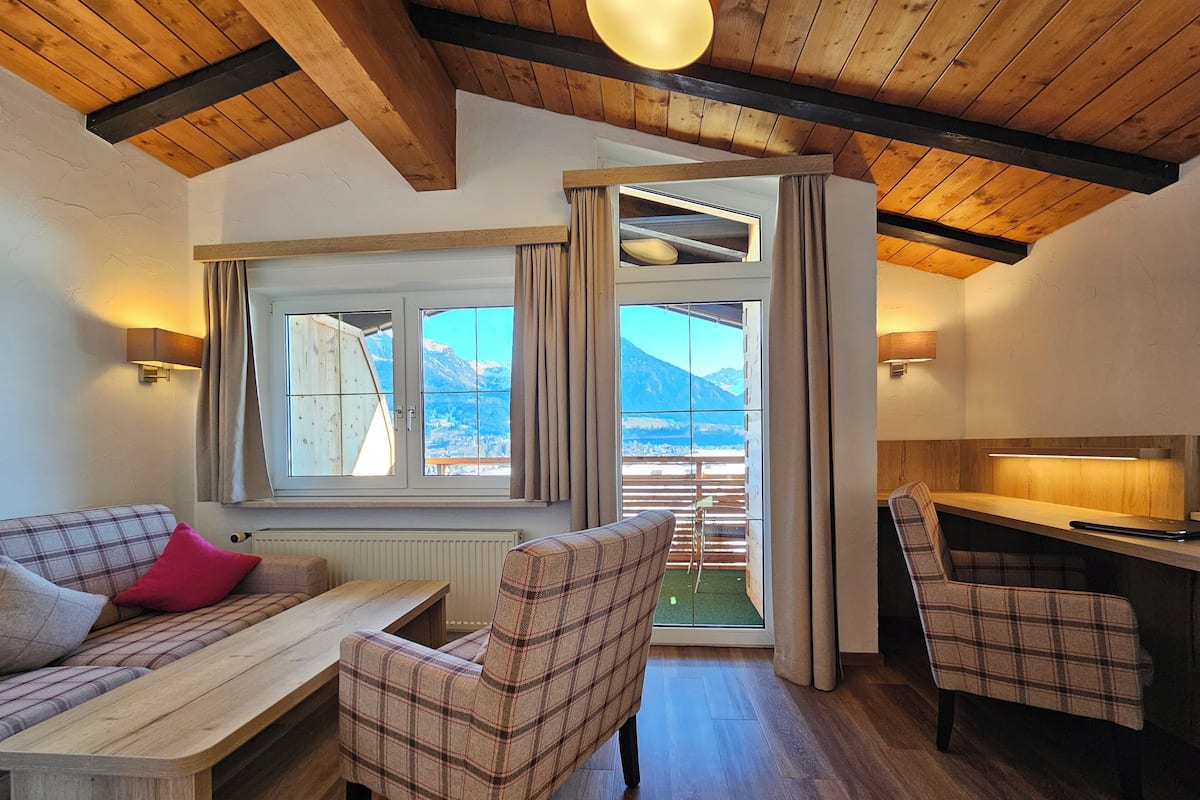 Grand Apartment, 2 Bedrooms, Balcony, Mountain View (6 Adults) | Living area | Flat-screen TV