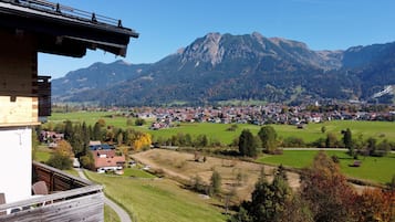 A mountain town with a view of a large mountain range.