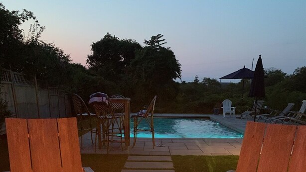 A backyard with a fire pit, outdoor seating, and a swimming pool. - Stunning hse-AC, heatd Pool, spa, fire pit, private acre, walk/free bus to town (Nantucket)
