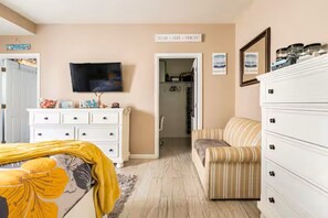 A bedroom with a bed, a television, a dresser, a chair, and a closet. - Pool! Out of HGTV! Linens, Bikes, Beach gear, elev, oceanview, luxury! (Wildwood Crest)