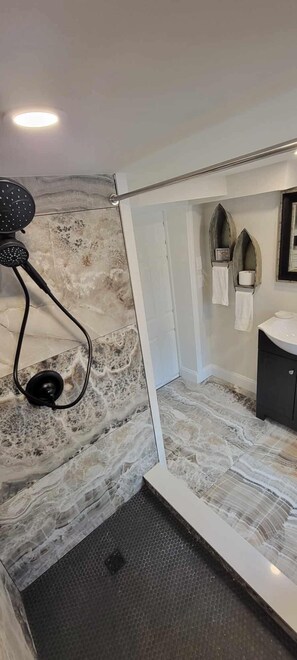Combined shower/tub, hair dryer, towels, toilet paper