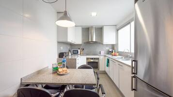 Fridge, microwave, coffee/tea maker, dining tables