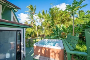 Relax in your own private hot tub ... peek at the ocean thru coconut grove!