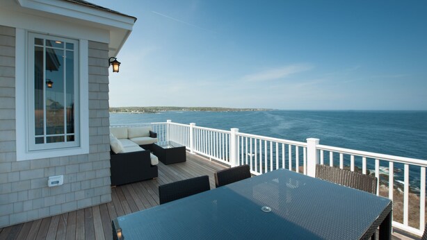 A deck with outdoor seating and a view of the ocean. - Exclusive Oceanfront Retreat with Endless Atlantic Views (York Beach)