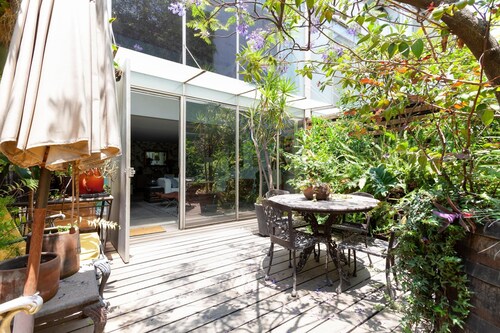 Marvelous, Art-Filled Loft with a Garden Terrace