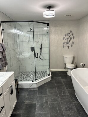 Bathtub, jetted tub, hair dryer, towels