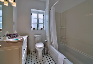 Combined shower/tub, hair dryer, towels, soap