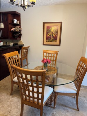 Enjoy meals in this cozy dining area with a round table and comfortable seating for four.