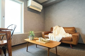 Deluxe Room | Living room | Flat-screen TV - Residence Hotel Stripe Sapporo (Sapporo)