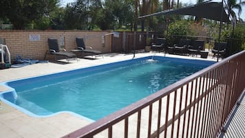 Outdoor pool, open 8:00 AM to 8:00 PM, pool loungers