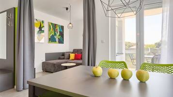 Apartment, 1 Bedroom, Sea View | Living area | Flat-screen TV