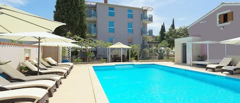 Outdoor pool, open 9:00 AM to 9:00 PM, free pool cabanas, pool umbrellas