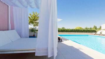Outdoor pool, open 9:00 AM to 9:00 PM, free pool cabanas, pool umbrellas
