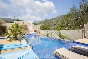 Outdoor pool, pool umbrellas, pool loungers