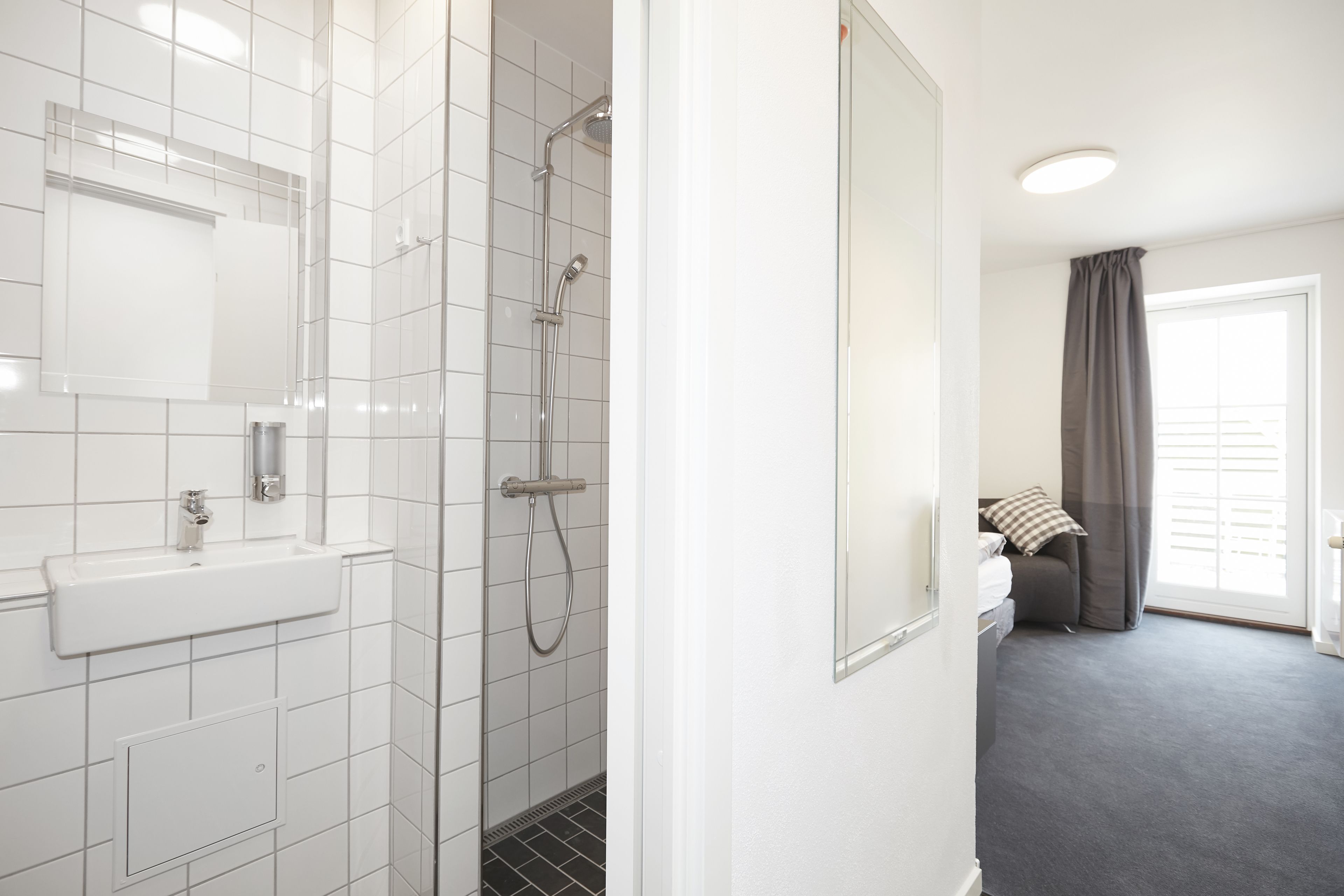 single room | premium bedding, desk, blackout curtains, soundproofing