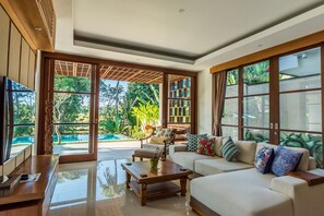 Luxury Villa, 3 Bedrooms, Private Pool, Pool View | Living room | LCD TV, DVD player, iPod dock, MP3 dock - Villa Rusa Biru (Canggu)